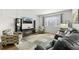 Comfortable living room with large window at 5230 Periwinkle Way, Henderson, CO 80640