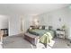 Spacious main bedroom features plush gray carpet and soothing light-gray paint throughout at 5230 Periwinkle Way, Henderson, CO 80640