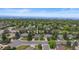 Suburban homes and mature trees stretch to the mountains on the horizon at 5853 S Havana Ct, Englewood, CO 80111