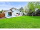 Expansive backyard featuring a patio area with colorful outdoor seating, perfect for entertaining guests at 5853 S Havana Ct, Englewood, CO 80111