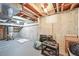 This unfinished basement contains utilities and storage at 5853 S Havana Ct, Englewood, CO 80111