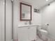 This finished bathroom has a shower, vanity, toilet, and neutral color scheme at 5853 S Havana Ct, Englewood, CO 80111