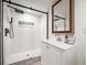 This finished bathroom has a shower, vanity, and neutral color scheme at 5853 S Havana Ct, Englewood, CO 80111