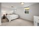 This finished bedroom has neutral walls, carpet, and lighting and includes a window at 5853 S Havana Ct, Englewood, CO 80111