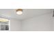 This empty bedroom has neutral walls, carpet, and lighting and includes a window at 5853 S Havana Ct, Englewood, CO 80111