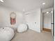 Neutral bedroom featuring a closet, carpet, and modern decor at 5853 S Havana Ct, Englewood, CO 80111