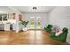 Bright bonus room with hardwood floors and French doors leading to the backyard at 5853 S Havana Ct, Englewood, CO 80111