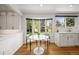 Bright breakfast nook with bay window, and hardwood floors provides great natural light at 5853 S Havana Ct, Englewood, CO 80111