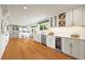 Bright, expansive kitchen boasts stainless appliances, wine cooler, and ample white cabinetry at 5853 S Havana Ct, Englewood, CO 80111
