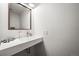 Stylish powder room with modern sink, faucet, and patterned accent accessories at 5853 S Havana Ct, Englewood, CO 80111