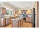 Well-equipped kitchen with stainless steel appliances, custom cabinets and hardwood floors at 4505 S Yosemite St # 106, Denver, CO 80237