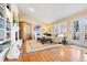 Cozy living room with hardwood floors, a fireplace, and French doors to the patio at 4505 S Yosemite St # 106, Denver, CO 80237
