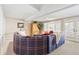 Relaxing living room features a large plaid couch and an abundance of natural light at 4505 S Yosemite St # 106, Denver, CO 80237
