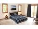 Bright bedroom with stylish bed, natural light from windows, and access to balcony at 9274 Sandy Ln, Conifer, CO 80433