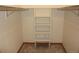 Walk-in closet featuring built-in shelving and ample storage space at 9274 Sandy Ln, Conifer, CO 80433