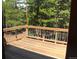 View from an interior looking out onto the wooden deck and forest at 9274 Sandy Ln, Conifer, CO 80433