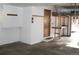 Garage with storage shelves, work bench, and exterior access door at 9274 Sandy Ln, Conifer, CO 80433