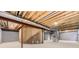 Unfinished basement showcasing the home's structural framework at 19406 E Maplewood Pl, Aurora, CO 80016