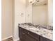 Bathroom features a granite countertop and modern sink at 19406 E Maplewood Pl, Aurora, CO 80016