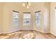 Bright dining area with hardwood floors, chandelier, and natural lighting at 19406 E Maplewood Pl, Aurora, CO 80016