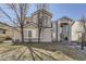 Charming two-story home featuring a manicured front yard, stucco exterior, and mature trees at 19406 E Maplewood Pl, Aurora, CO 80016