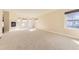 Open living room with corner fireplace and carpeted floor at 19406 E Maplewood Pl, Aurora, CO 80016