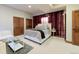 Well lit bedroom offers large closets, sitting area, and stylish decor at 7022 Secrest Ct, Arvada, CO 80007