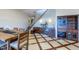 Dining room area with built in bar, dining table, and staircase to upper level at 7022 Secrest Ct, Arvada, CO 80007