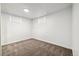 Simple basement bedroom with neutral carpeting and window at 348 Emery Rd, Northglenn, CO 80233