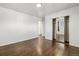 Minimalist bedroom featuring hardwood floors and a mirrored closet, maximizing space at 348 Emery Rd, Northglenn, CO 80233