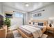 Light and airy bedroom with hardwood floors and natural light at 348 Emery Rd, Northglenn, CO 80233