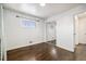 Cozy bedroom with hardwood floors, ample natural light, and a mirrored closet at 348 Emery Rd, Northglenn, CO 80233