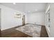 Bright living room with hardwood floors and a neutral rug, showcasing the open space at 348 Emery Rd, Northglenn, CO 80233