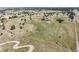 Sweeping aerial perspective of expansive land with scattered trees and distant buildings, showcasing rural charm at 8855 E Parker Rd, Parker, CO 80138