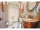 This bathroom features granite countertops, new toilet, and a decorative mirror at 8855 E Parker Rd, Parker, CO 80138