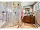 This bathroom features a walk-in shower, vanity, and a large window for ample light at 8855 E Parker Rd, Parker, CO 80138
