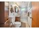 This bathroom features a glass shower and built-in wooden storage cabinets at 8855 E Parker Rd, Parker, CO 80138