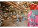 The garage is equipped with a workbench, various tools, and ample storage at 8855 E Parker Rd, Parker, CO 80138
