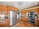 Kitchen featuring custom cabinetry, stainless steel appliances, tile floors, and a modern aesthetic at 8855 E Parker Rd, Parker, CO 80138