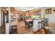 Open kitchen features wood cabinets, an eat-in breakfast bar, tile floor, and modern appliances at 8855 E Parker Rd, Parker, CO 80138