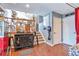 Inviting entryway featuring stylish furniture, wood floors, and staircase to the upper level at 2079 S Quintero St, Aurora, CO 80013