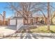 Charming two-story home with brick accents, a two-car garage, and a well-maintained front yard at 2079 S Quintero St, Aurora, CO 80013