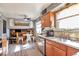 Cozy kitchen features wood cabinets, stainless appliances, and an open floorplan with great sunlight at 2079 S Quintero St, Aurora, CO 80013