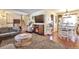 Inviting living area featuring a cozy fireplace, hardwood floors, and an open layout at 2079 S Quintero St, Aurora, CO 80013
