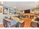 Cozy living room with a brick fireplace, movie-themed decor, and comfortable seating at 2079 S Quintero St, Aurora, CO 80013
