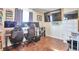 This home office features wood floors, a media center, lots of lighting, and computer equipment at 2079 S Quintero St, Aurora, CO 80013