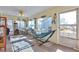 This sun room features lots of windows, natural light and a relaxing hammock at 2079 S Quintero St, Aurora, CO 80013