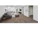 Finished basement with a large sectional couch and ample space for entertaining at 235 N 12Th Ave, Brighton, CO 80601