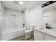 Updated bathroom with white marble tile and a soaking tub at 235 N 12Th Ave, Brighton, CO 80601