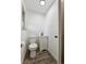 Modern half-bathroom with a sleek vanity and tiled floors at 235 N 12Th Ave, Brighton, CO 80601